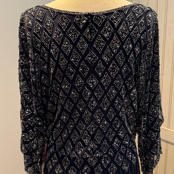 NWT Pisarro Nights beaded split sleeve gown.
6P Navy Blue - Picture 5 of 7